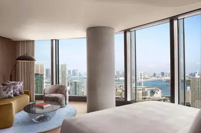 a bedroom with a bed and a view of the city at JW Marriott Hotel Tokyo in Tokyo