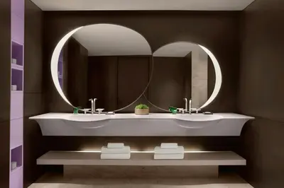 a bathroom with a sink and a mirror at JW Marriott Hotel Tokyo in Tokyo
