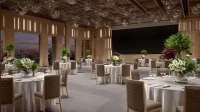 a conference room with tables and chairs and a projection screen at JW Marriott Hotel Tokyo in Tokyo