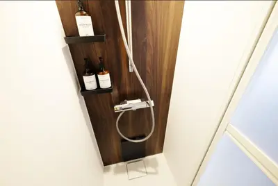 a shower with two bottles of wine in a room at Yoyogi Flats - Vacation STAY 19767 in Tokyo