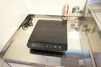 a device sitting on top of a glass table at Yoyogi Flats - Vacation STAY 19767 in Tokyo