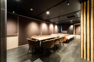 a conference room with a long table and chairs at Koala Inn Ueno in Tokyo