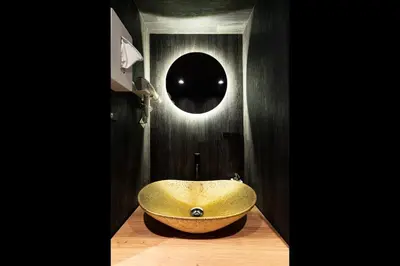 a bathroom with a gold bowl sink in a room at Koala Inn Ueno in Tokyo