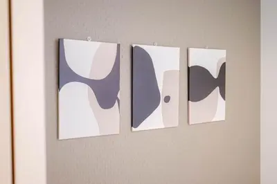 four pieces of art hanging on a wall at JAPAN APARTMENT HOTEL Itabashi-station, Tokyo in Tokyo