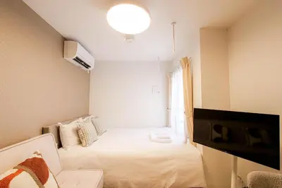 a small room with a bed and a window at JAPAN APARTMENT HOTEL Itabashi-station, Tokyo in Tokyo