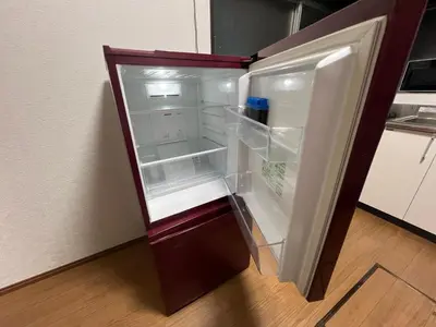 an empty refrigerator with its door open in a kitchen at Tokyo Family & Pet Friendly Villa in Tokyo