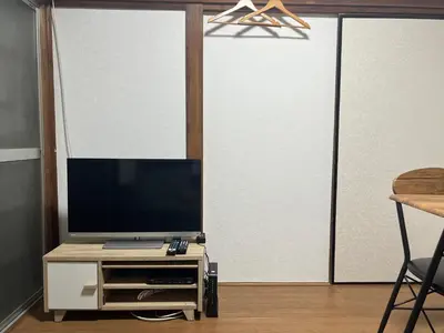 a living room with a flat screen tv on a stand at Tokyo Family & Pet Friendly Villa in Tokyo
