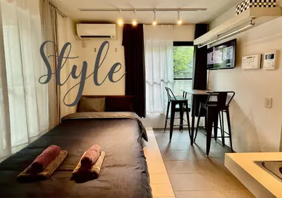 a bedroom with a bed and a sign that says life at Proto Shibuya Shinsen Style in Tokyo