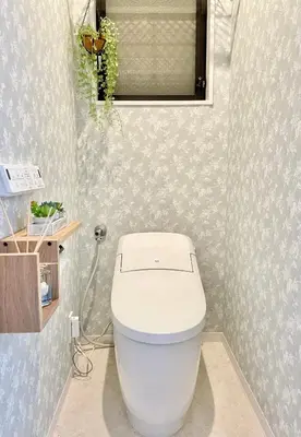 a bathroom with a white toilet in a room at Sunlit Retreat Home-2 min from Shinjuku Station in Tokyo
