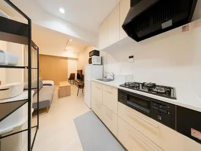a kitchen with a stove and a refrigerator at Asakusa-Akihabara-Family-Friendly Stay- 4min Walk to Oshiage Sta- Switch & Mobile Wi-Fi in Tokyo