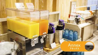 an orange drink in a blender on a counter at HOTEL DREAM GATE maihama - Main & Annex in Urayasu