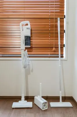 a hair dryer in a room next to a window at THE CAMINO Nakano 202 in Tokyo