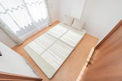 a room with a bed and a couch and a window at Sheath Okachimachi Apartment Hotel in Tokyo