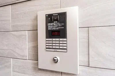 a pay phone on the side of a wall at Sheath Okachimachi Apartment Hotel in Tokyo