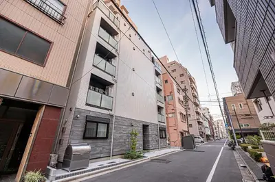 an empty street in a city with tall buildings at Sheath Okachimachi Apartment Hotel in Tokyo