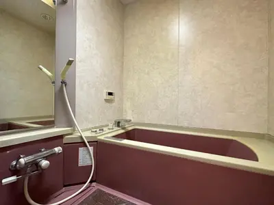 a bathroom with a red tub and a shower at North Tokyo Grand Inn in Tokyo