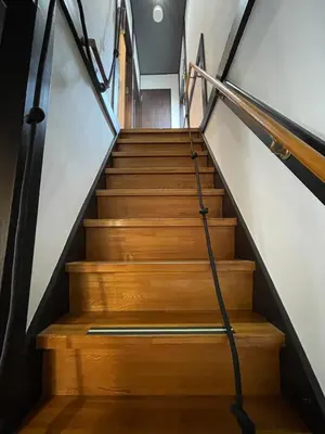 a staircase in a house with wooden stairs at \u30a2\u30f3\u30c9\u30b9\u30c6\u30a4\u65b0\u4e952\u4e01\u76ee in Tokyo