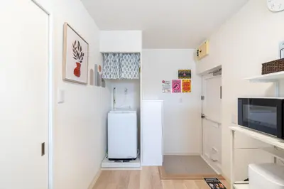 a small kitchen with a refrigerator in a room at \u304b\u3064\u3089301 in Tokyo