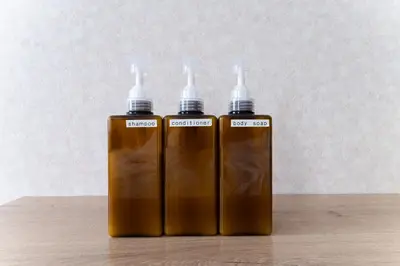 two brown bottles of liquids sitting on a table at shinjuku-ookubo Apartment room101 in Tokyo
