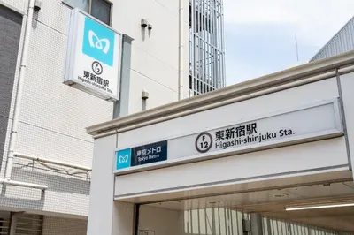 a sign on the side of a building at shinjuku-ookubo Apartment room101 in Tokyo