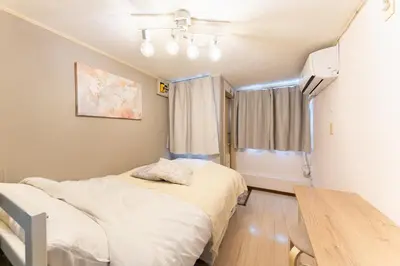 a hospital room with a bed and a table at shinjuku-ookubo Apartment room101 in Tokyo