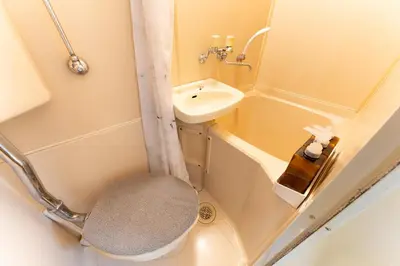 a small bathroom with a sink and a toilet at shinjuku-ookubo Apartment room102 in Tokyo