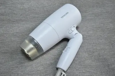 a white wii remote sitting on top of a table at shinjuku-ookubo Apartment room201 in Tokyo