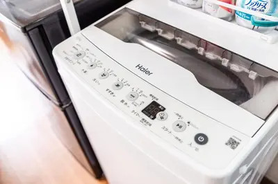 a washer and dryer sitting in a refrigerator at shinjuku-ookubo Apartment room202 in Tokyo