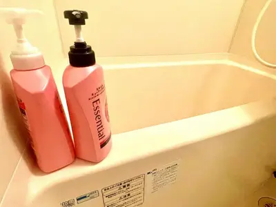 two bottles ofodorizers sitting on top of a bath tub at Tokyo West Shinjuku close to Shinjuku Chuo Park in Tokyo