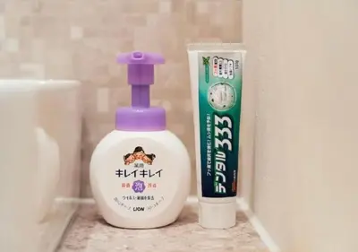a bottle of detergent next to a container of toothpaste at Oshiage SAIEI Hotel 401 in Tokyo