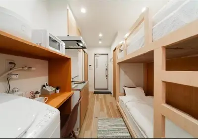 a small room with a bunk bed and a bathroom at Oshiage SAIEI Hotel 403 in Tokyo