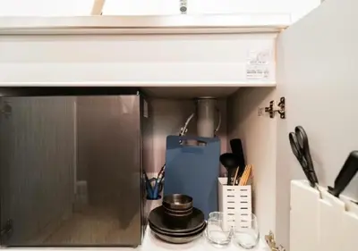 a kitchen with a counter top with a microwave at Oshiage SAIEI Hotel 402 in Tokyo