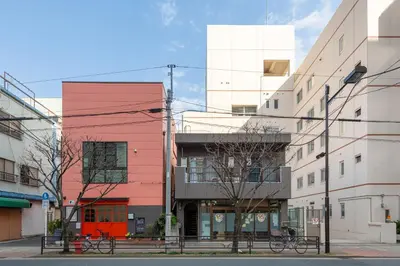 a group of buildings on a city street at \u3071\u3093\u3060\u30db\u30b9\u30c6\u30eb\u5ca9\u8c37 in Tokyo