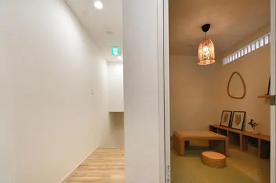 a hallway of a house with a pendant light at miraisya kyojima in Tokyo
