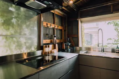 a kitchen with a sink and a window at Ivy Harajuku in Tokyo