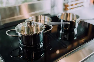 a couple of pots and pans on a stove at Ivy Harajuku in Tokyo