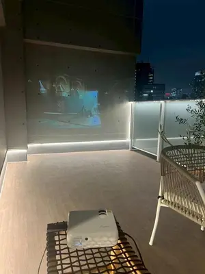 a laptop computer sitting on top of a balcony at Monthly \u516d\u672c\u6728\u9ebb\u5e03\u30b9\u30ab\u30a4\u30c6\u30e9\u30b9 in Tokyo