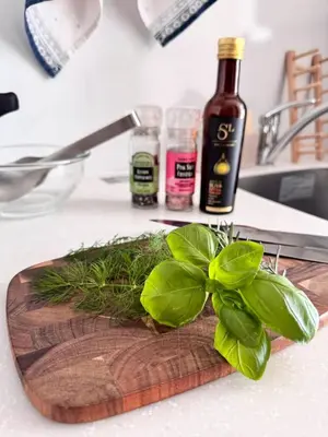 a wooden cutting board with a bunch of greens on it at Monthly \u516d\u672c\u6728\u9ebb\u5e03\u30b9\u30ab\u30a4\u30c6\u30e9\u30b9 in Tokyo