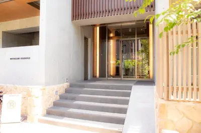 a staircase leading to a building with a glass door at \u516d\u672c\u6728\u9ebb\u5e03\u30b9\u30ab\u30a4\u30c6\u30e9\u30b9 in Tokyo