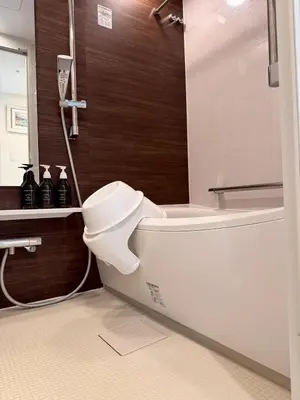 a bathroom with a toilet and a sink and a shower at \u516d\u672c\u6728\u9ebb\u5e03\u30b9\u30ab\u30a4\u30c6\u30e9\u30b9 in Tokyo