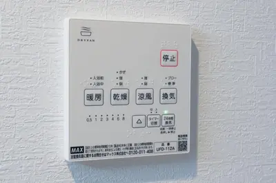 an electronic socket on a white wall at Seven's Inn Tateishi in Tokyo