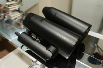 two black objects sitting on a glass table at MATSUBARA Inn by Tranova in Tokyo
