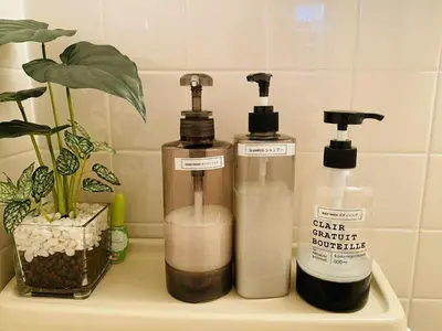 two bottles of soap sitting on a shelf at The Aki Shinjuku in Wada