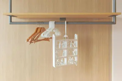 a kitchen cabinet with a rack with cooking utensils at U Place Shimokitazawa by Tranova in Tokyo