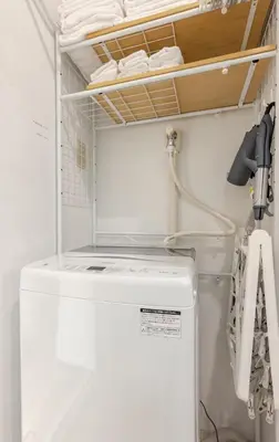 a white refrigerator in a kitchen with a shelf at sgc\u6771\u7acb\u77f32\u4e01\u76ee in Tokyo