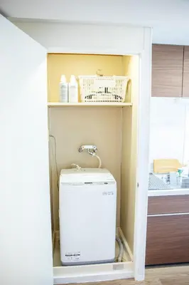 a laundry room with a washer and dryer at 4 min to Shinjuku - Up to 8pax - 3BR - Near Shibuya, Harajuku in Tokyo