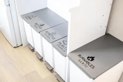 a row of white tables with boxes on them at 4 min to Shinjuku - Up to 8pax - 3BR - Near Shibuya, Harajuku in Tokyo