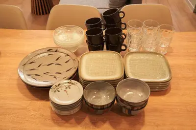 a table with plates and glasses on a table at SGC\u8535\u524d2\u4e01\u76ee3f in Tokyo