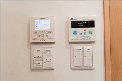 a wall with an electronic device on a wall at SAIE Sakura hotel in Tokyo