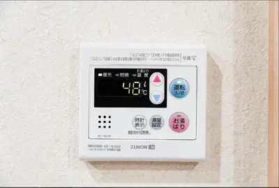 an electronic device is attached to a wall at SAIE Sakura hotel in Tokyo